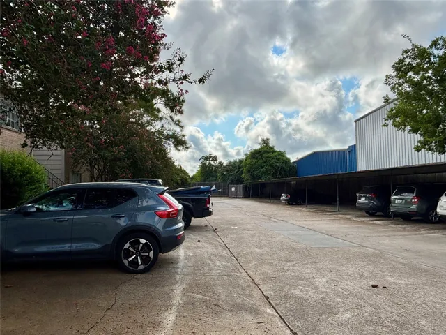 a view of a car parked in front of a house