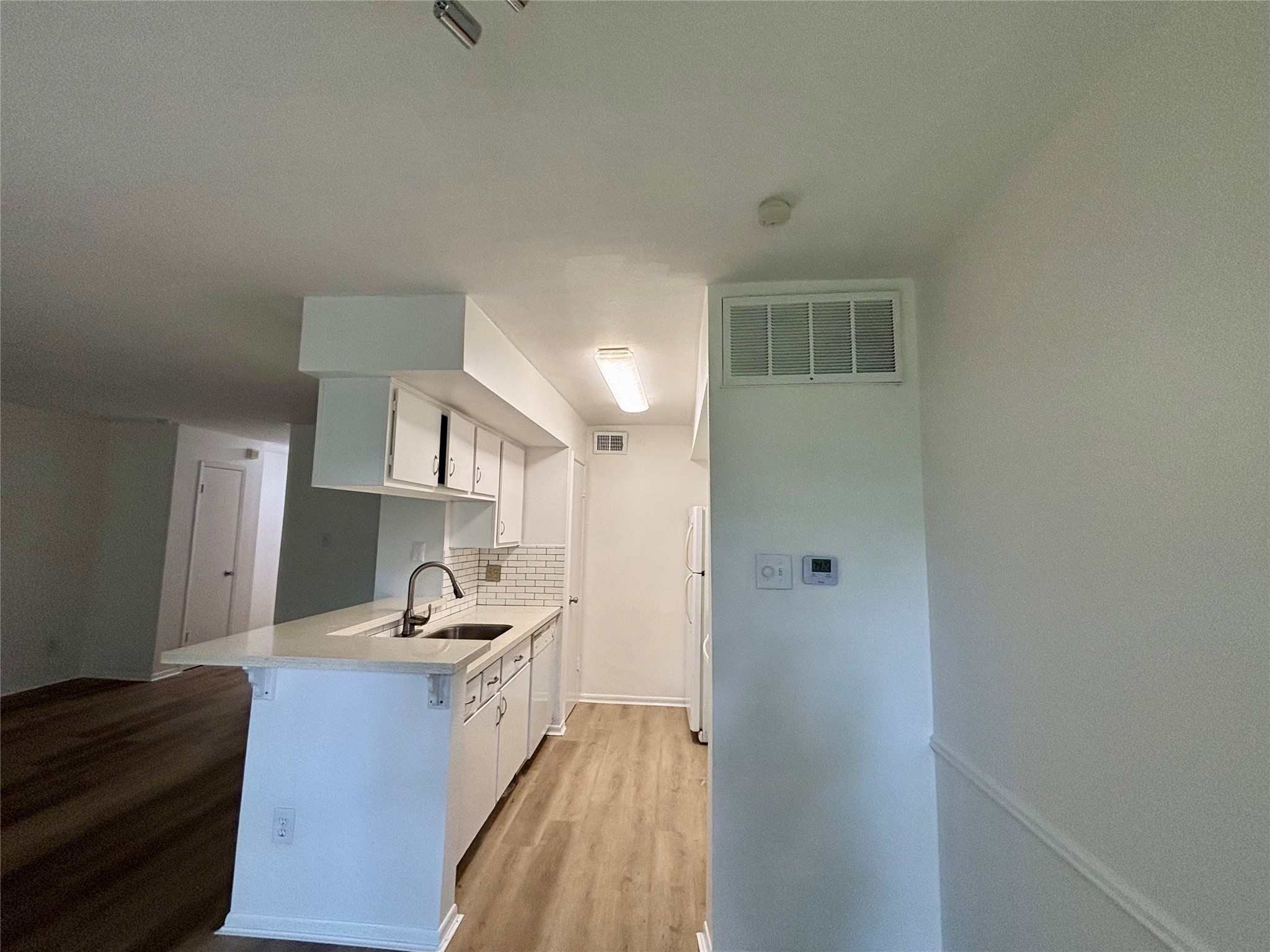 2800 Jeanetta Street, Unit 2008 Houston, TX 77063 - Photo 6 of 22 a kitchen with a sink and a refrigerator