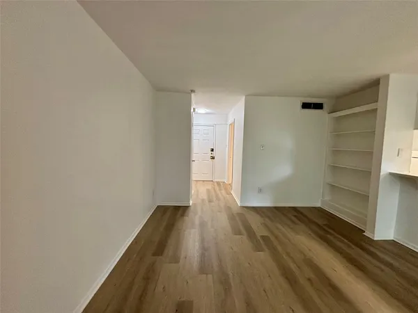 a view of wooden floor in an empty room