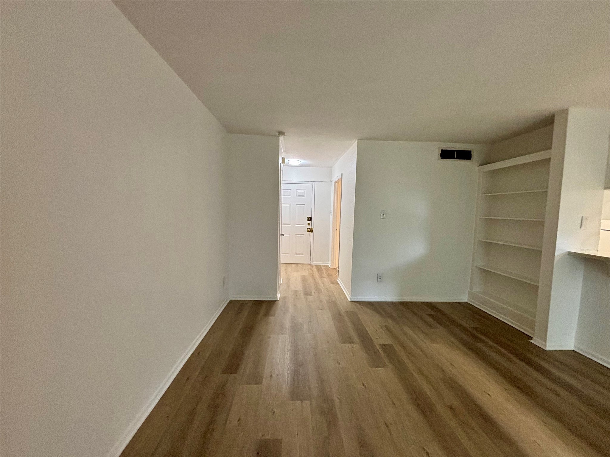 2800 Jeanetta Street, Unit 2008 Houston, TX 77063 - Photo 8 of 22 a view of wooden floor in an empty room