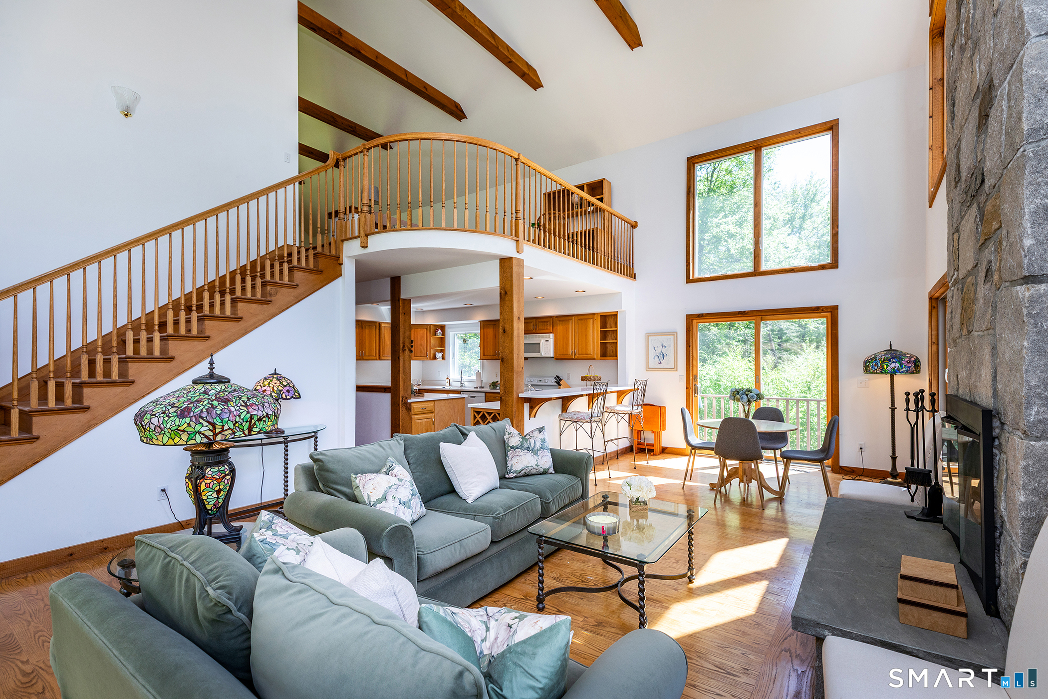 3 Old Forest Road Sherman, CT 06784 - Photo 7 of 38 a living room with furniture stairs and a large window