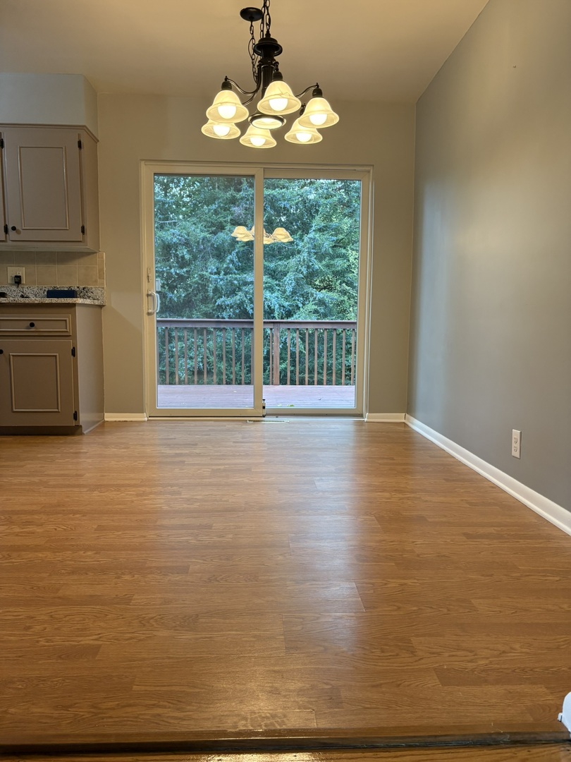 5209 12th Avenue Moline, IL 61265 - Photo 11 of 33 a view of a kitchen with wooden floor