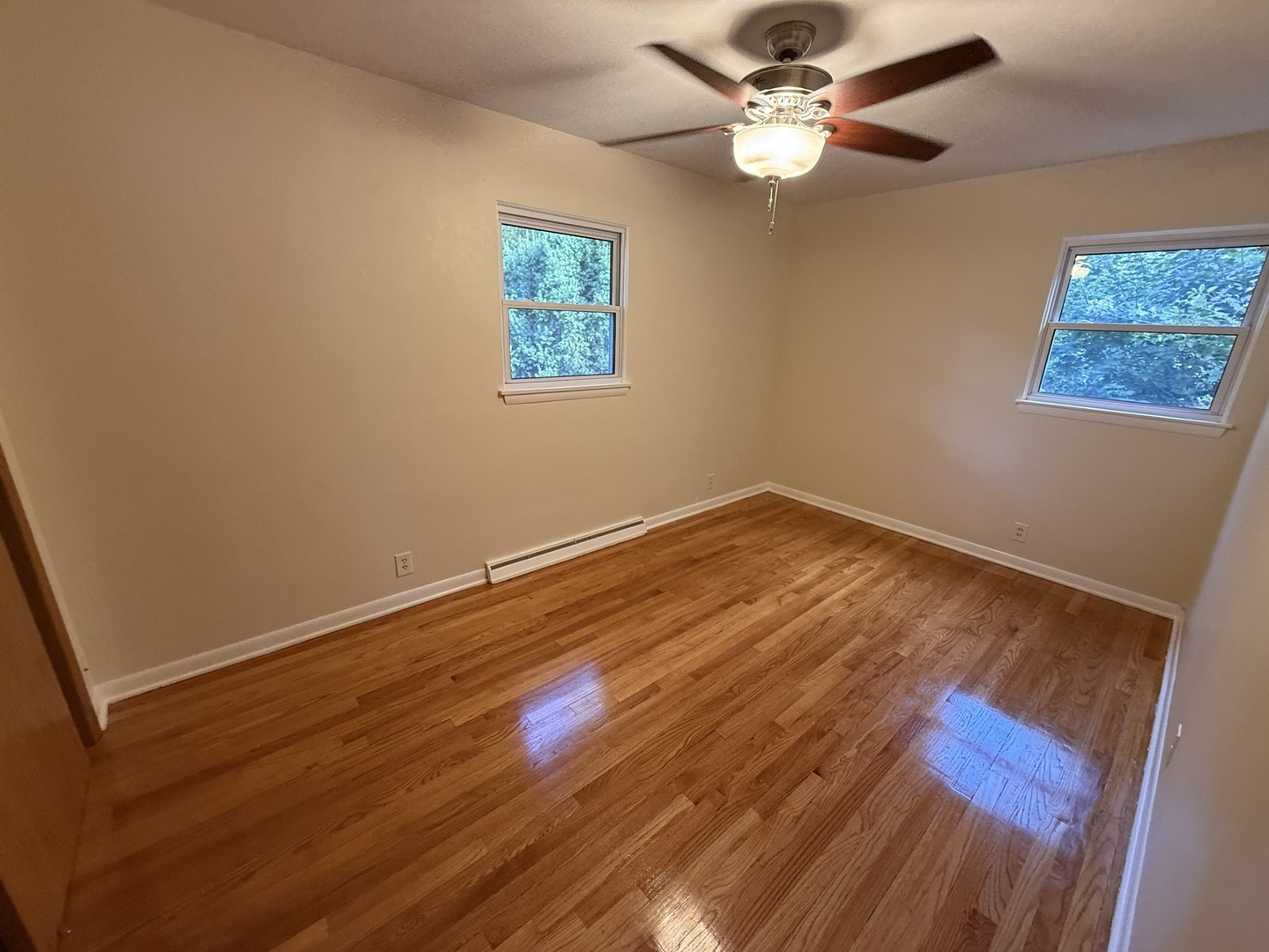 5209 12th Avenue Moline, IL 61265 - Photo 19 of 33 wooden floor in an empty room with a window