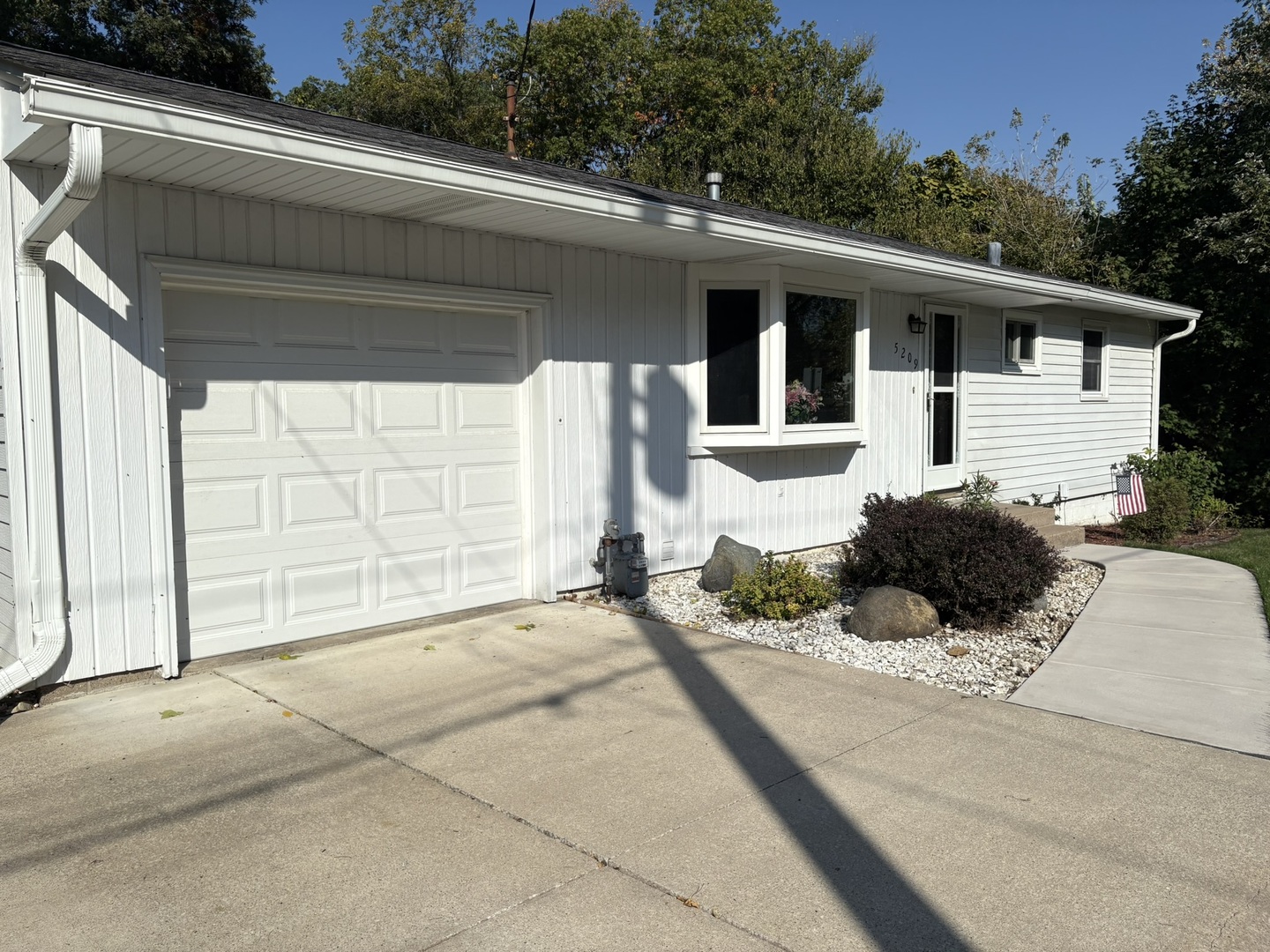 5209 12th Avenue Moline, IL 61265 - Photo 2 of 33 a front view of a house with a garage