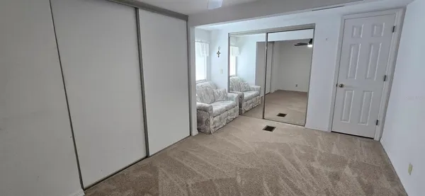 a large white room with closet