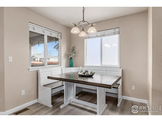 a kitchen with a table and chairs in it