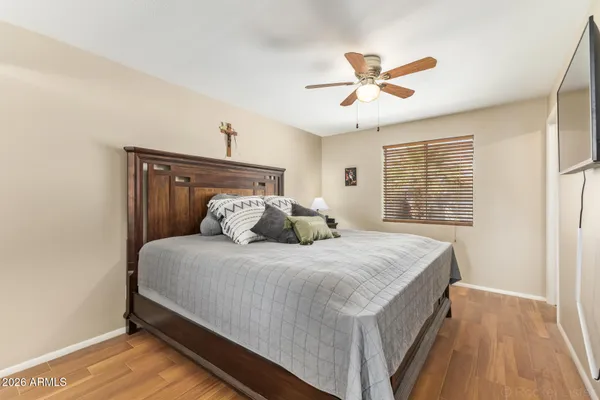 a bedroom with a bed and window