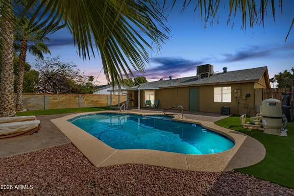 a view of a swimming pool with a patio