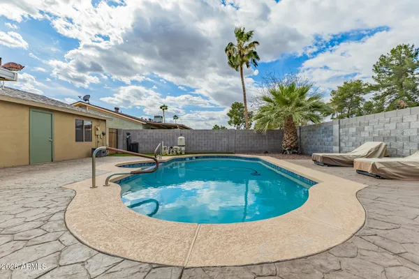 a view of a house with swimming pool
