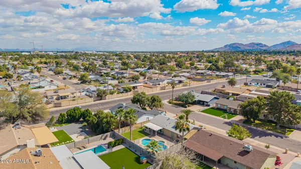 an aerial view of residential houses with outdoor space