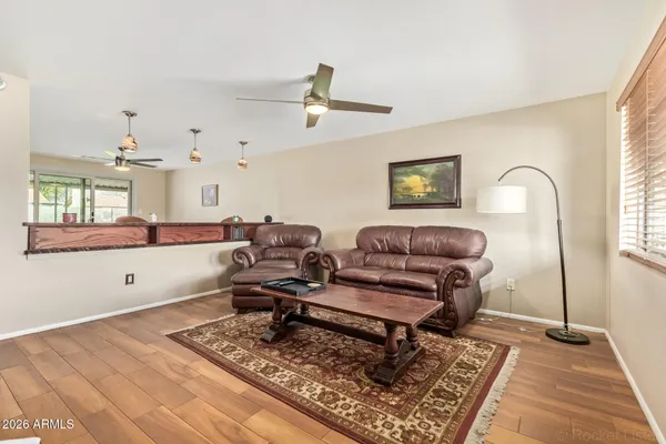 a living room with furniture and a rug