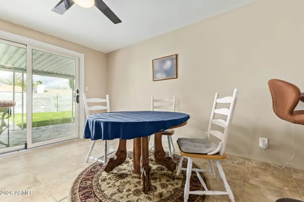 a view of a room that has a table and chair