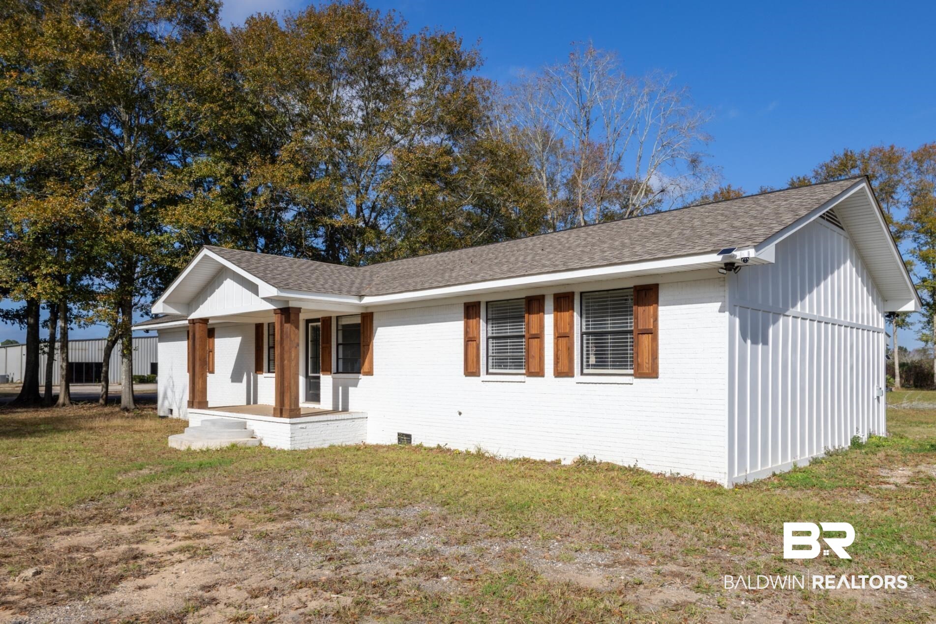 18267 Highway 98 Foley, AL 36535 - Photo 2 of 26 View of front of house with a front lawn, brick siding, and a shingled roof