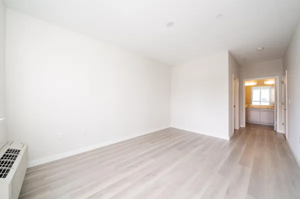 a view of an empty room and glass door