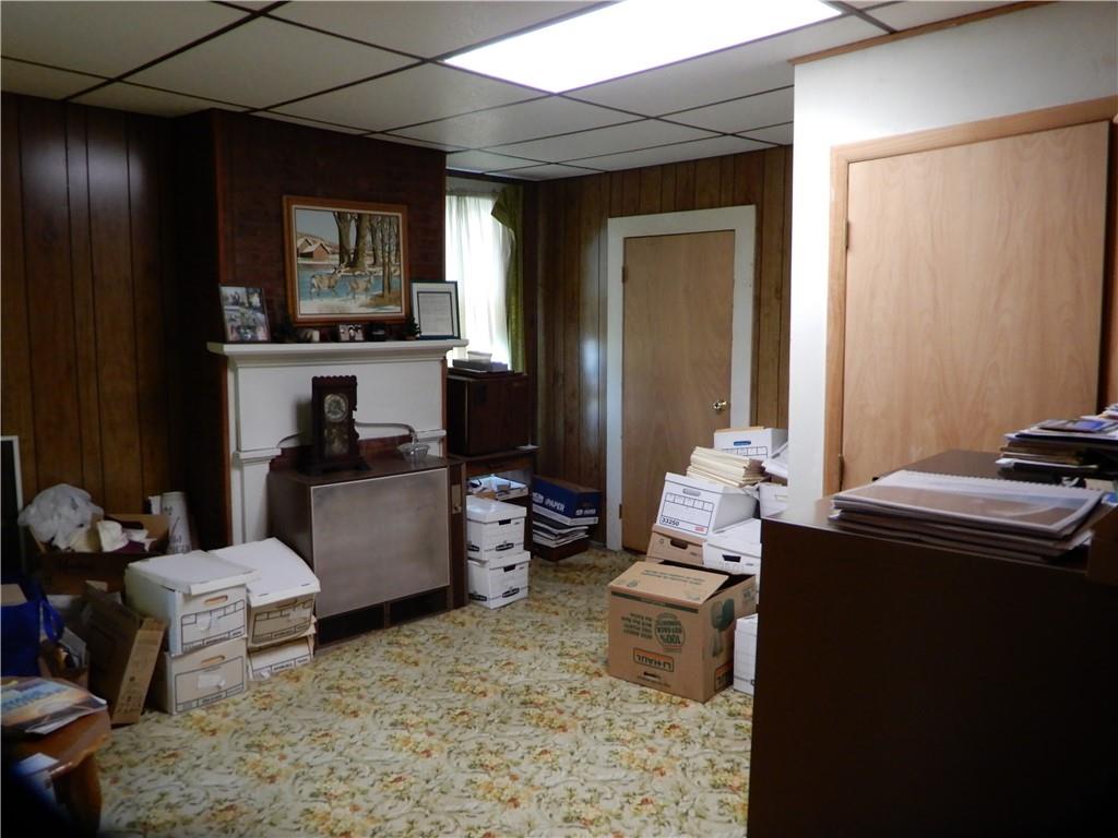 1185 Franklin Road Jackson Center, PA 16133 - Photo 7 of 16 a room with a couch and a storage