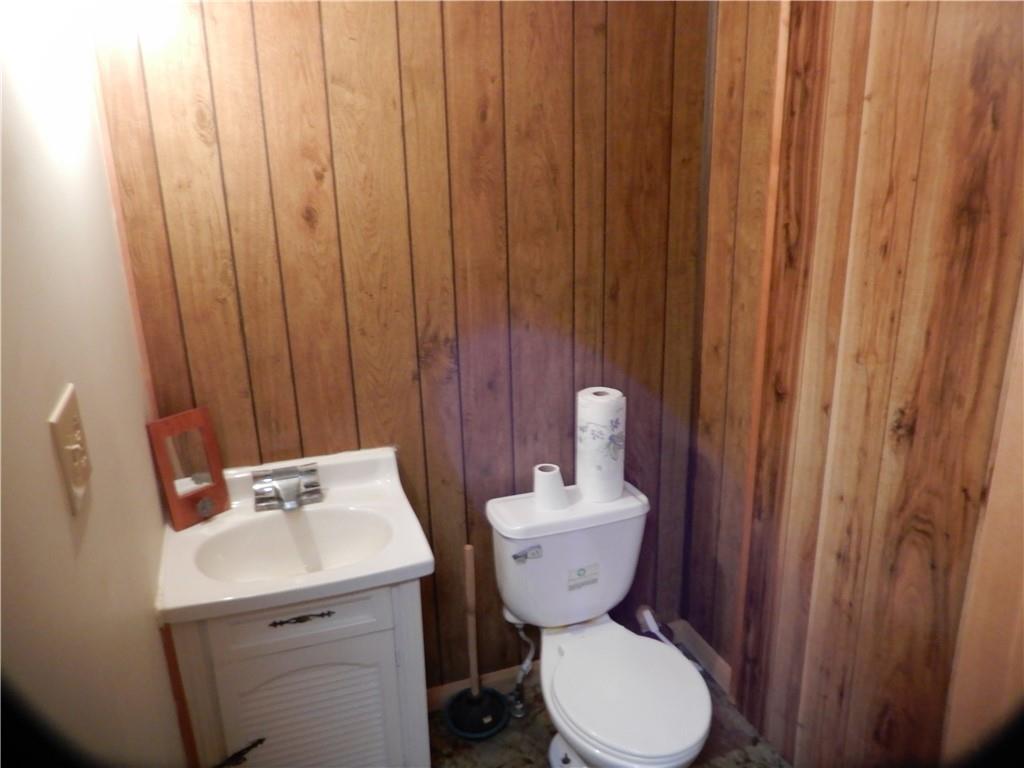 1185 Franklin Road Jackson Center, PA 16133 - Photo 8 of 16 a bathroom with a toilet a sink and a shower curtain