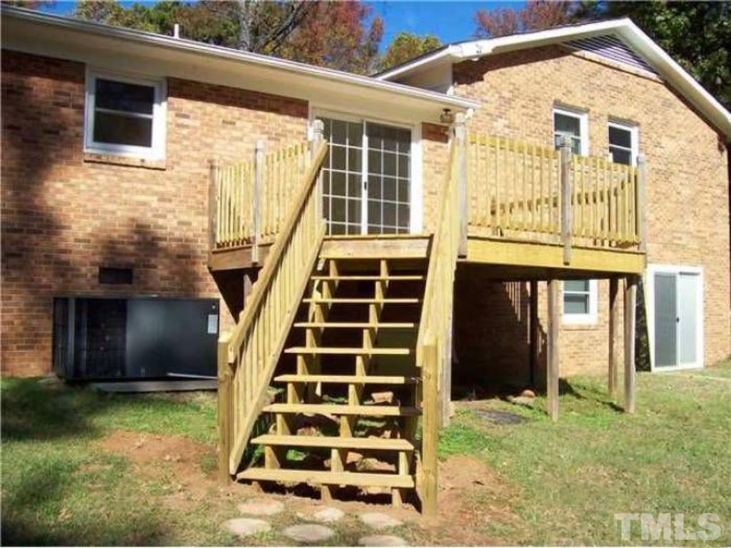 4110 Jimmy Rogers Road Durham, NC 27703 - Photo 14 of 14 a front view of a house with a yard