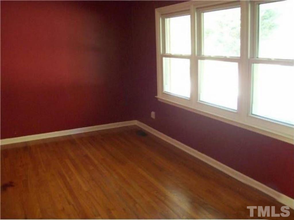 4110 Jimmy Rogers Road Durham, NC 27703 - Photo 6 of 14 an empty room with a window