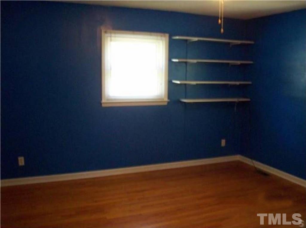 4110 Jimmy Rogers Road Durham, NC 27703 - Photo 7 of 14 a view of an empty room with a window