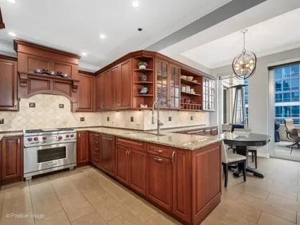 a kitchen with a stove and a sink