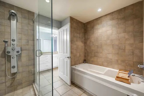 a bathroom with a bathtub and shower