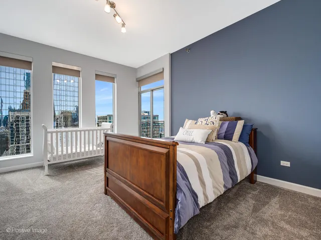 a bed sitting in a bedroom next to a balcony