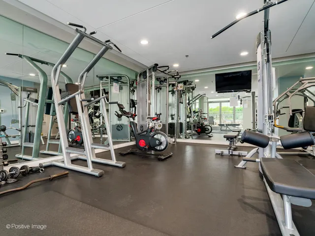 a view of a gym with gym equipment
