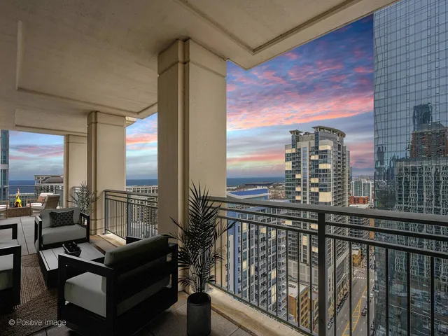 a view of roof deck with couches