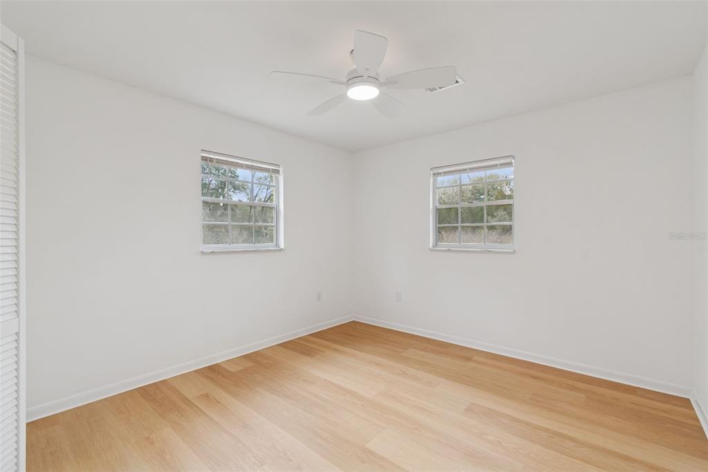 7011 Southwest 170th Street Archer, FL 32618 - Photo 22 of 35 a view of empty room with wooden floor