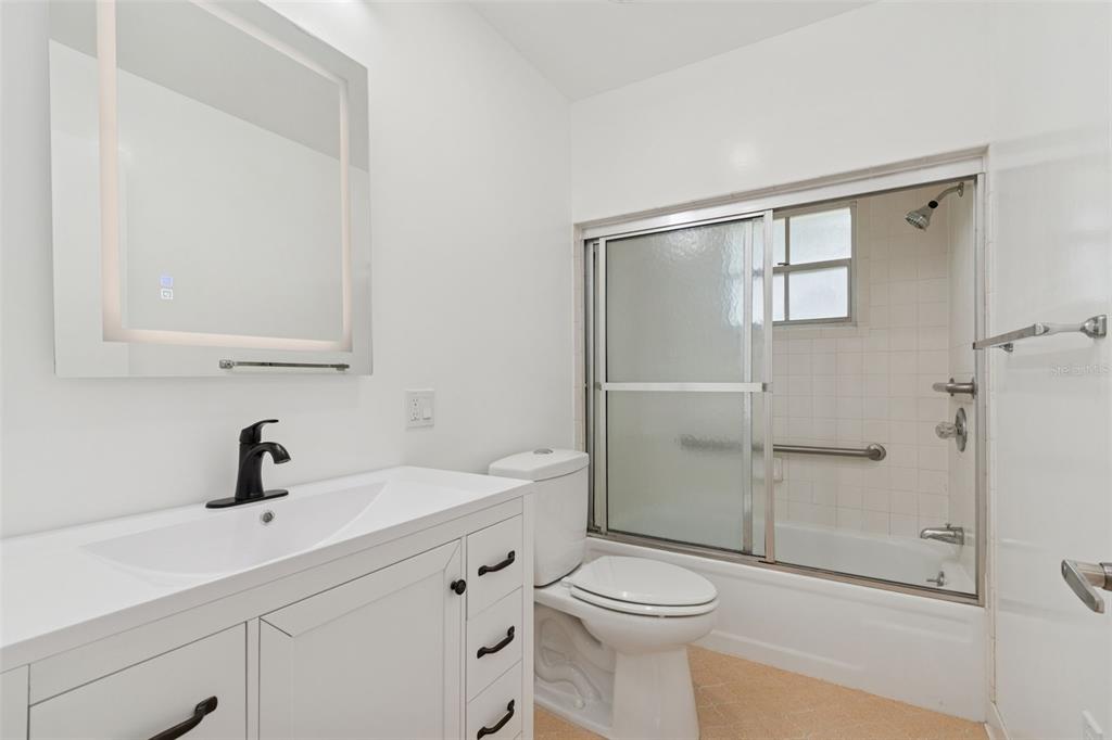 7011 Southwest 170th Street Archer, FL 32618 - Photo 23 of 35 a bathroom with a sink a toilet and shower