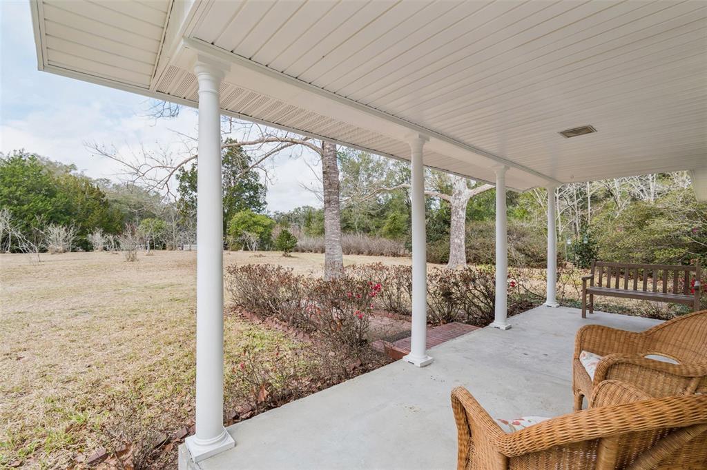 7011 Southwest 170th Street Archer, FL 32618 - Photo 3 of 35 a balcony with furniture and garden view