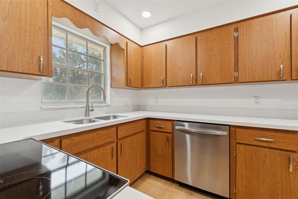 7011 Southwest 170th Street Archer, FL 32618 - Photo 9 of 35 a kitchen with a sink cabinets and window