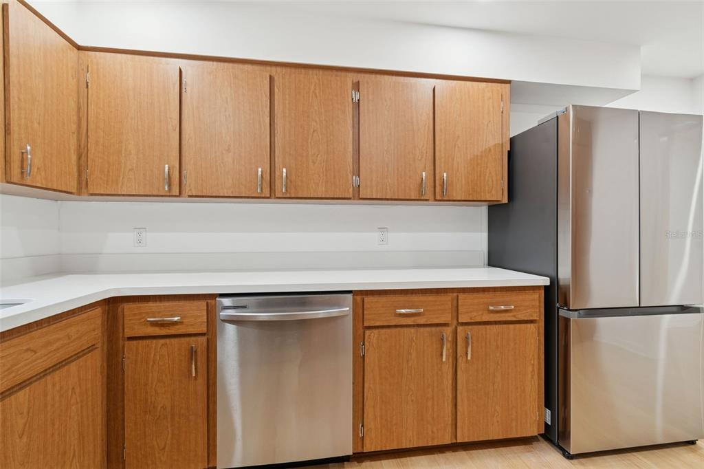 7011 Southwest 170th Street Archer, FL 32618 - Photo 10 of 35 a kitchen with cabinets and a refrigerator