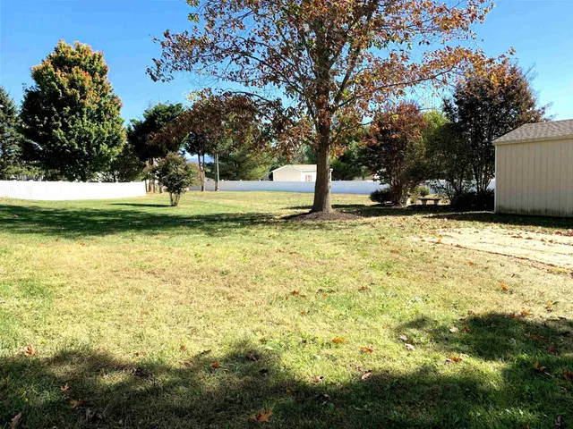 a view of swimming pool with a yard