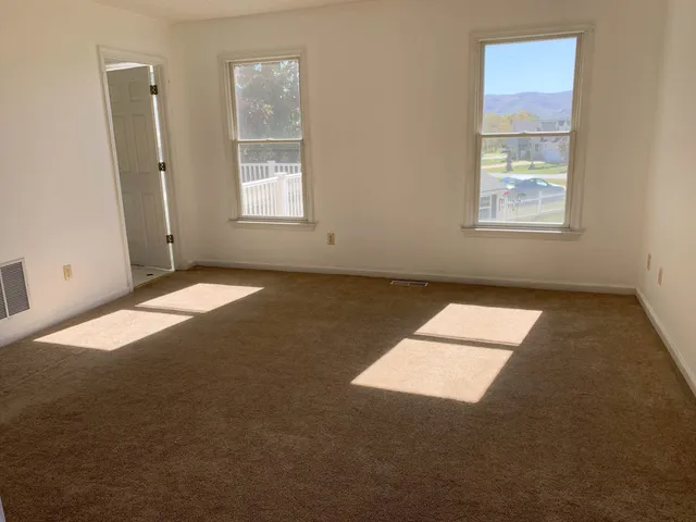 an empty room with windows