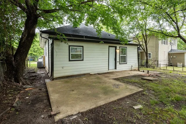 a house with trees in the background