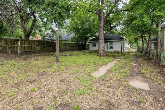 a backyard of a house with lots of green space