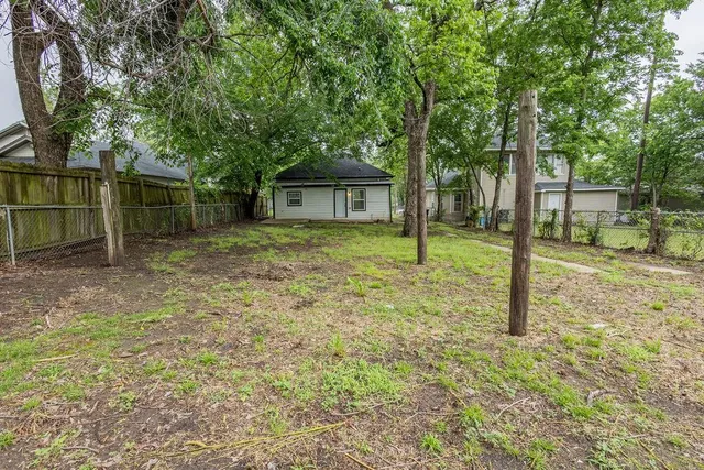 a house with trees in the background
