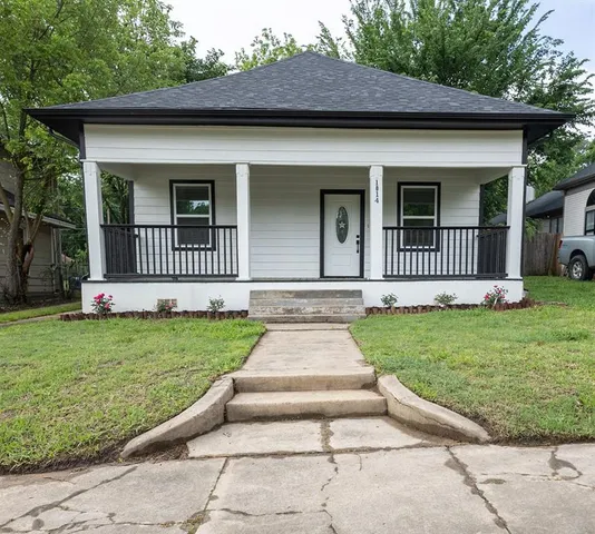 front view of a house with a yard