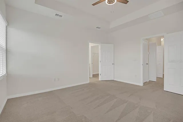 a bathroom with a sink a light fixture and a mirror