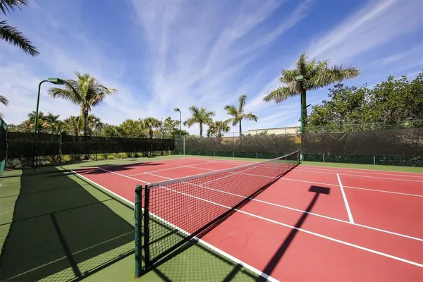 a tennis court with view of outdoor space