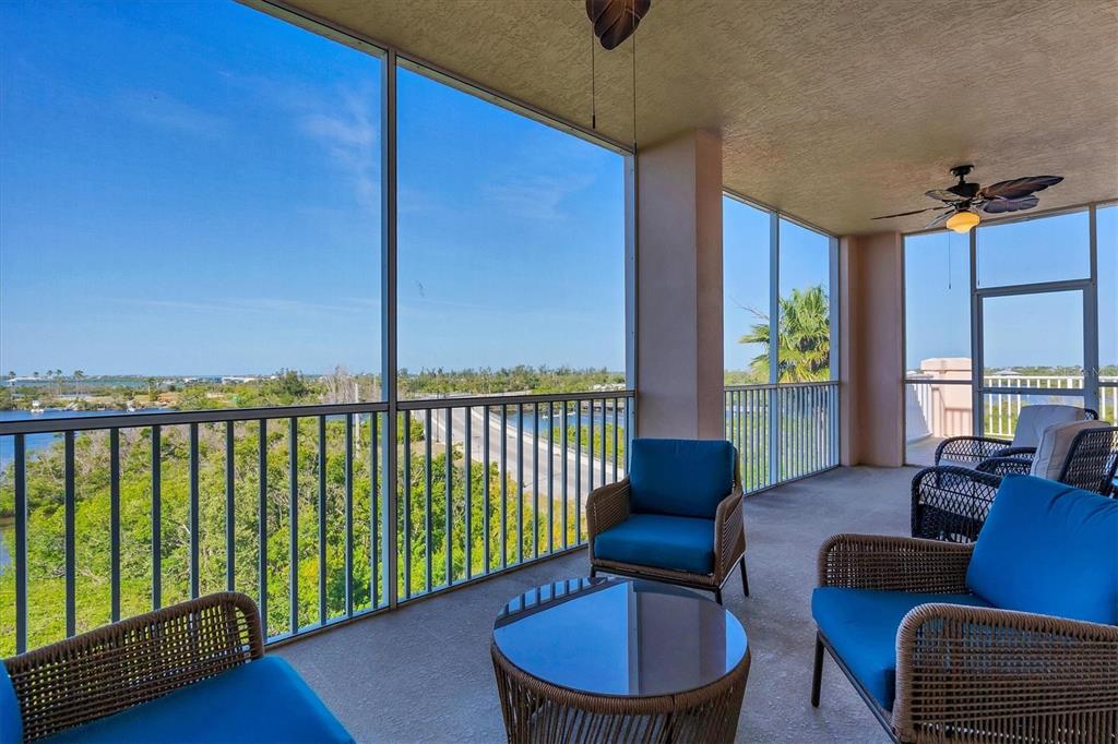 13113 Gasparilla Road, Unit 503 Placida, FL 33946 - Photo 15 of 18 a balcony with furniture and a potted plant