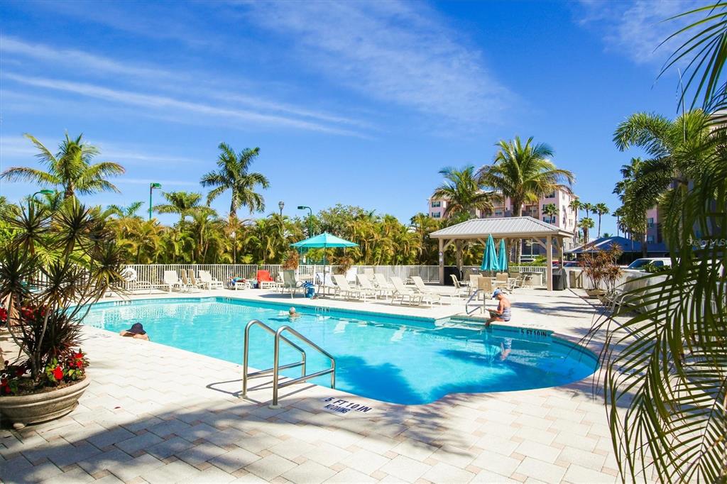 13113 Gasparilla Road, Unit 503 Placida, FL 33946 - Photo 16 of 18 a view of a swimming pool with a patio