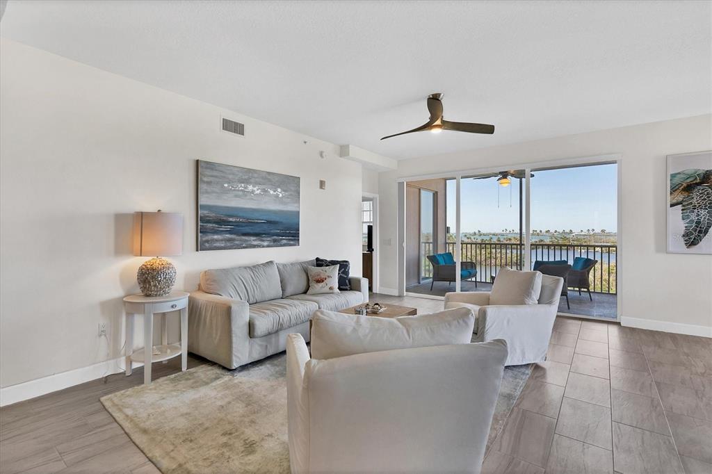 13113 Gasparilla Road, Unit 503 Placida, FL 33946 - Photo 3 of 18 a living room with furniture and a large window