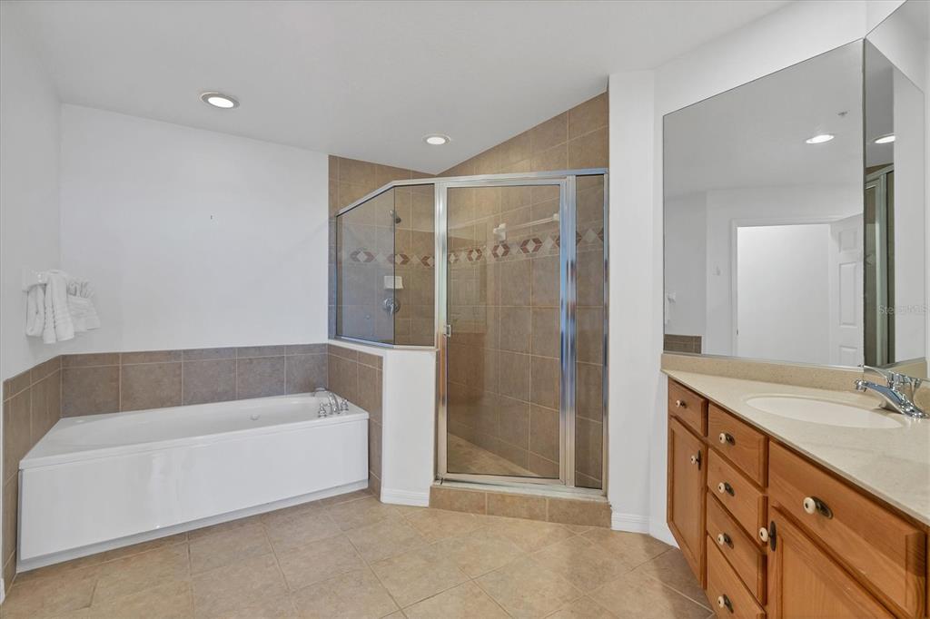 13113 Gasparilla Road, Unit 503 Placida, FL 33946 - Photo 8 of 18 a bathroom with a large tub shower and sink