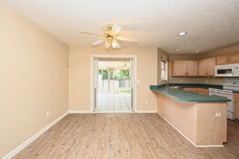 a view of a kitchen with a sink and a window