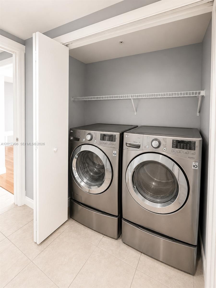 Brickell Miami, FL 33131 - Photo 18 of 19 a utility room with dryer and washer