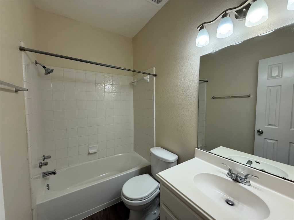 303 Kates Way Hutto, TX 78634 - Photo 11 of 15 a bathroom with a sink toilet and shower