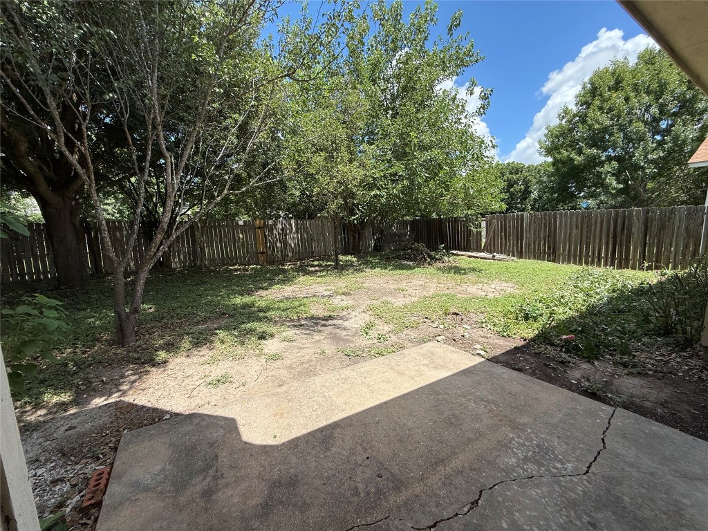 303 Kates Way Hutto, TX 78634 - Photo 13 of 15 a swimming pool with wooden fence