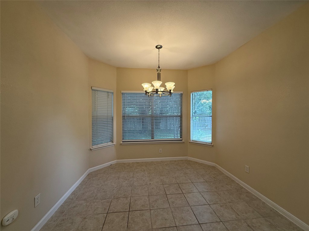 303 Kates Way Hutto, TX 78634 - Photo 5 of 15 a view of a room with a chandelier